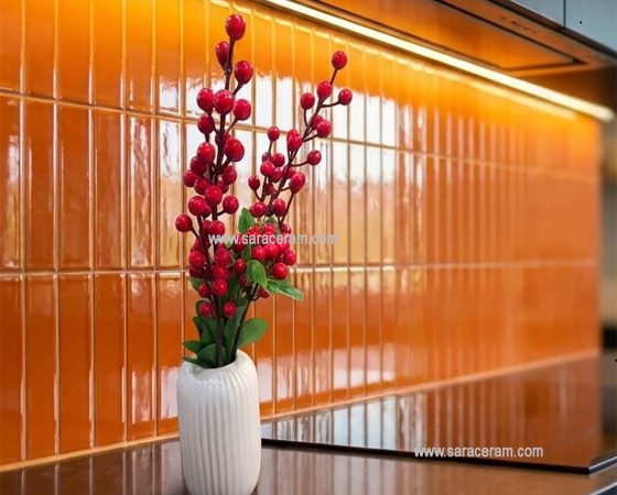 سرامیک بین کابینتی نارنجی TA1320S1R5-20 در ترکیب با کابینت مشکی